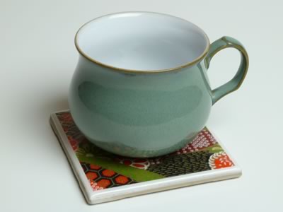 how to make tile coasters - finished with green cup