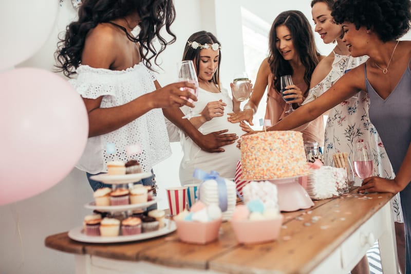 baby shower wishes party friend's hands on belly