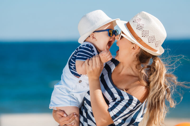 bible verses about mothers - mother with baby son at beach