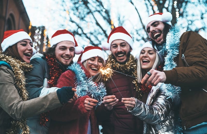 christmas wishes for friends mood image of friends outdoors with sparklers