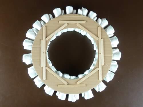 rolled diaper wreath step 3 reinforce wreath with popsicle sticks