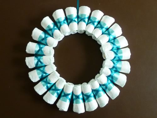rolled diaper wreath step 4 criss cross wrap
