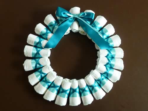 rolled diaper wreath step 5 attach bow