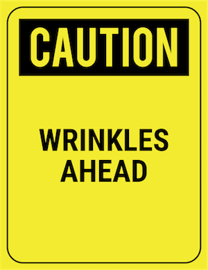 funny safety sign caution wrinkles ahead