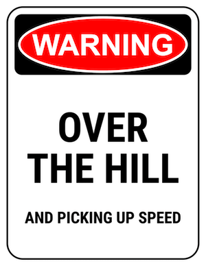 funny safety sign warning over the hill and picking up speed