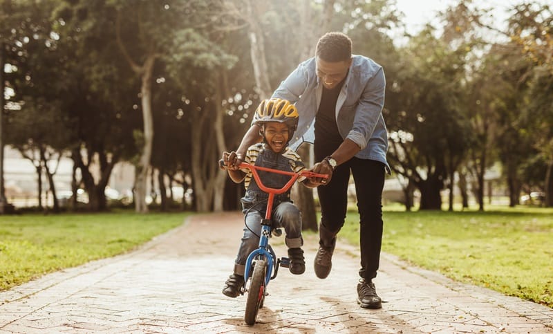 happy fathers day teaching son to ride a bike