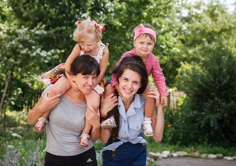 happy mother's day messages for friends two moms giving daughters piggyback rides