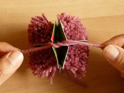 how to make pom poms step 6b