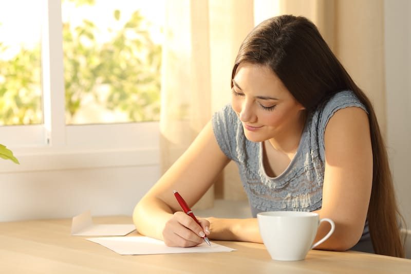 love letters for him writing with cup of coffee