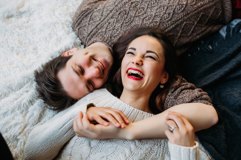 love messages for her laughing couple on floor