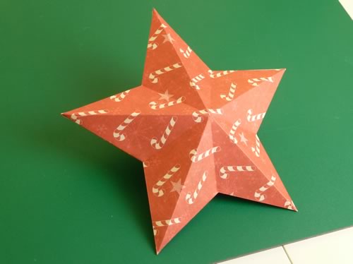 making christmas decorations completed double sided paper star