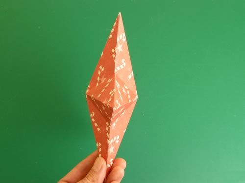 making christmas decorations completed double sided paper star side view
