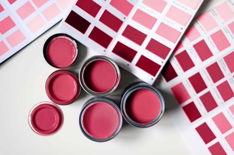 red and purple make magenta paint pots and paint swatches