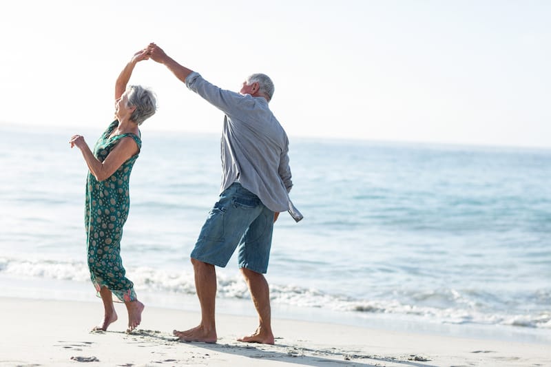 retirement quotes couple dancing on beach