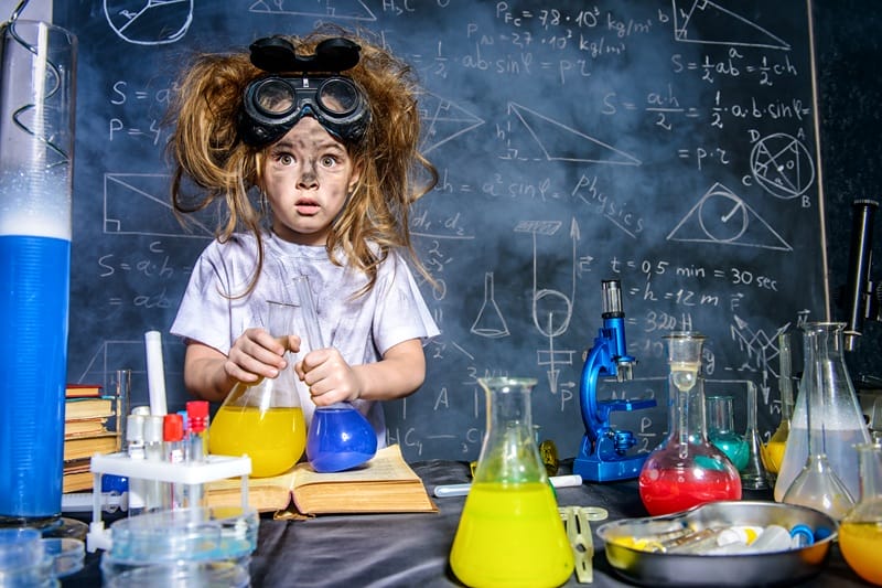 Scient Trivia Questions girl doing science experiment