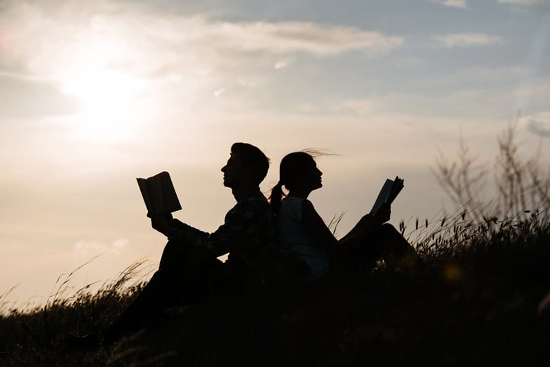 short love poems reading together at sunset silhouette