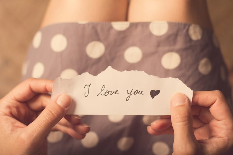short love quotes woman in dress holding note in hands