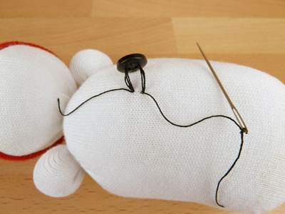 sock snowman - sewing on buttons