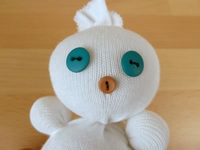 sock snowman - sewing on a face