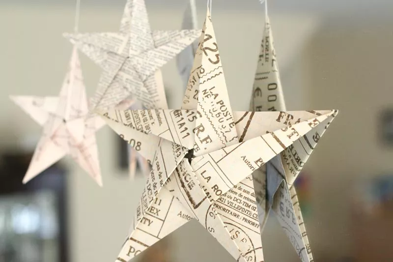 5 pointed origami stars hanging on mirror