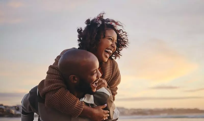 love poems for wife couple laughing together on the beach
