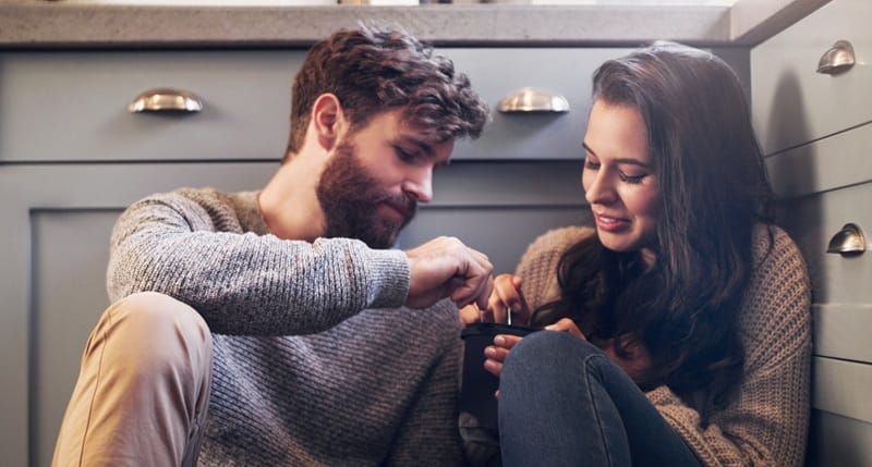 Questions to ask your girlfriend couple on a casual date sharing ice cream